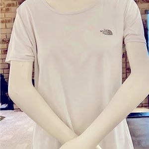 A women's white short sleeved North Face breathable shirt